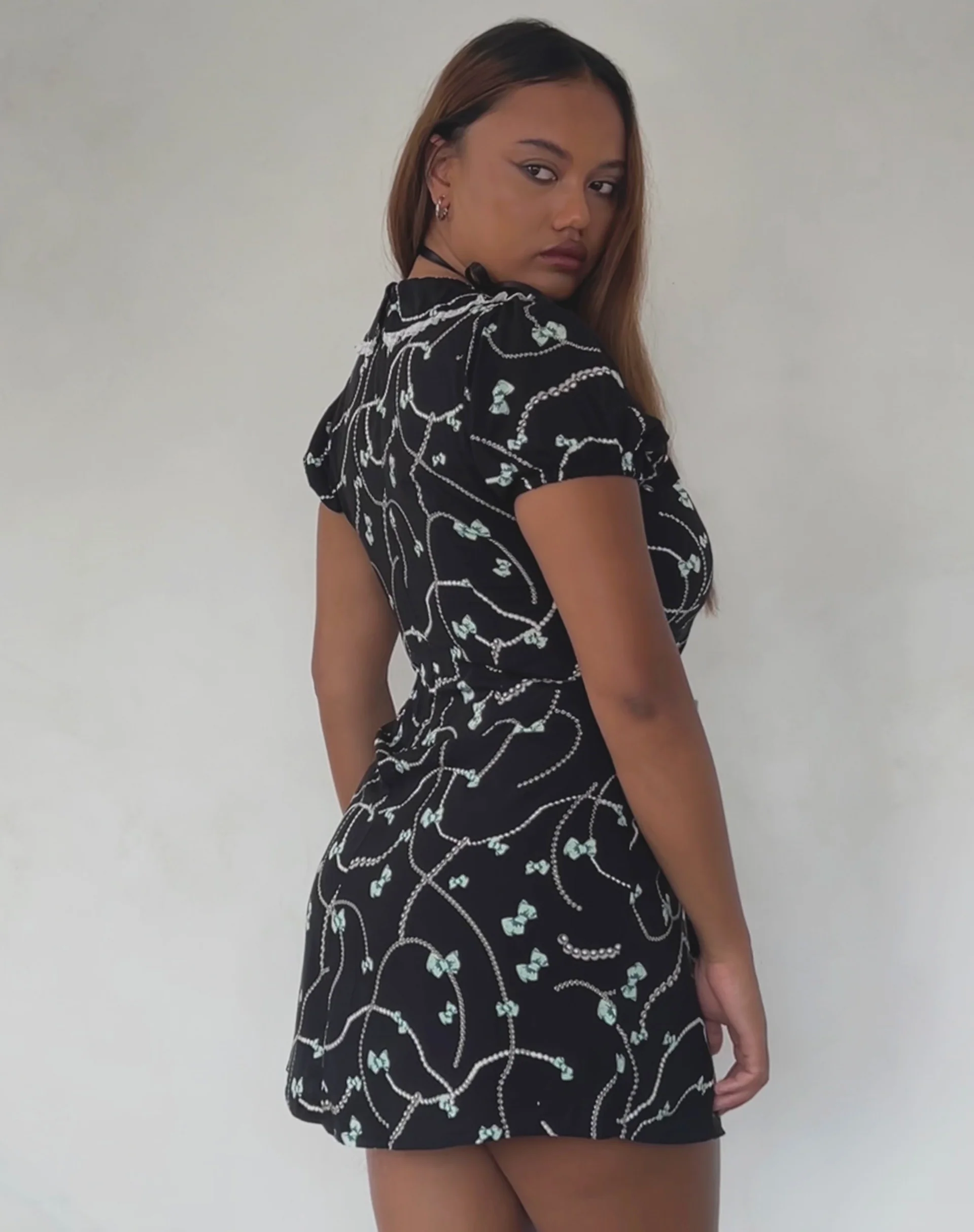 Sulani Mini Dress in Black with Pearl and Bow Print - Image 5